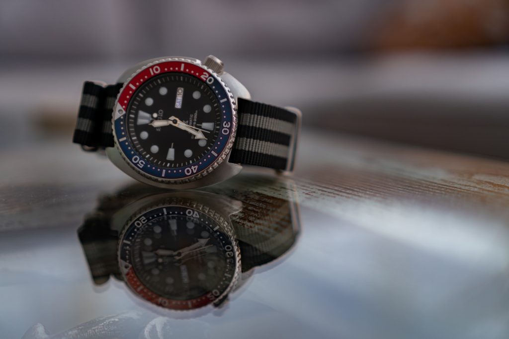 silver and black chronograph watch