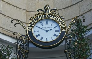 black and white round analog wall clock at 10 00