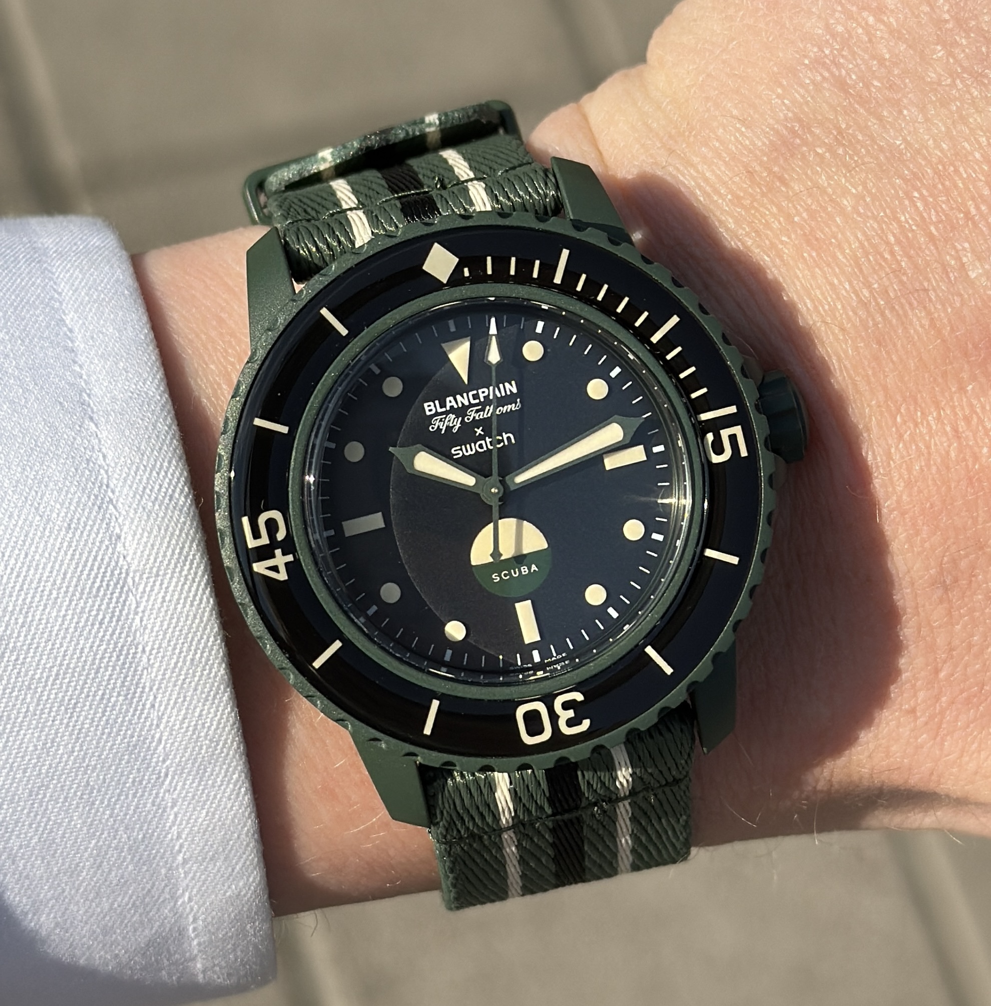 hands on the swatch x blancpain green abyss