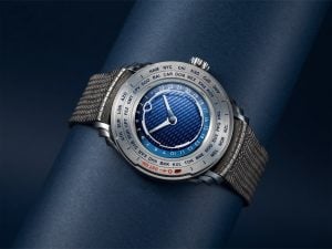 ming 57.05 comet i stål på polymesh-armband, med blå urtavla och stadsring med 24 destinationer