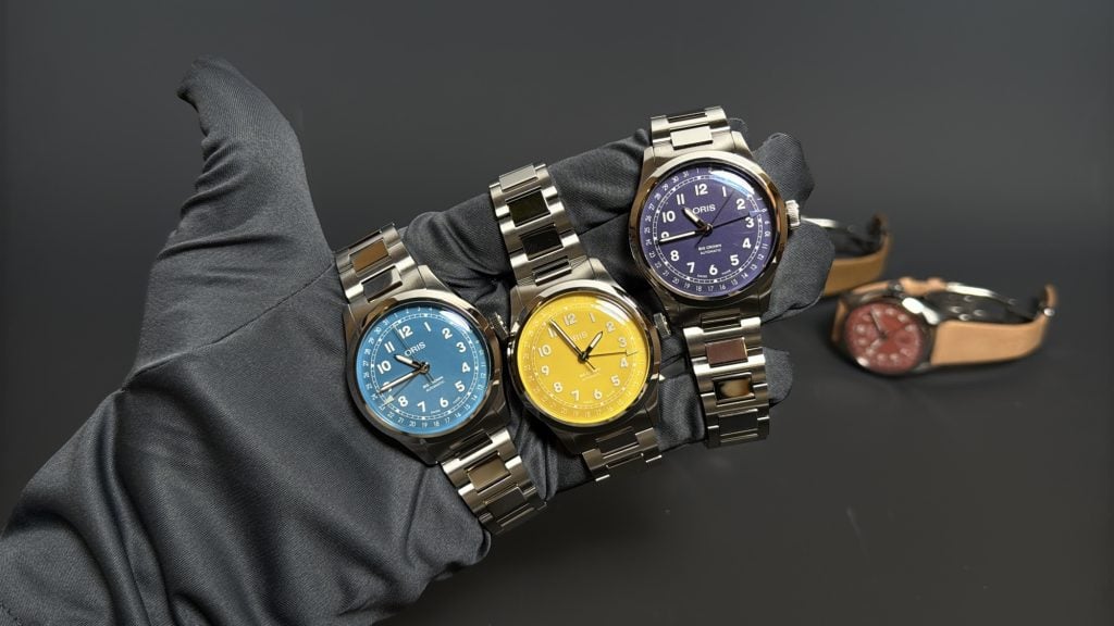 oris big crown pointer date i blått, gult och lila på det nya h-länksarmbandet i stål.