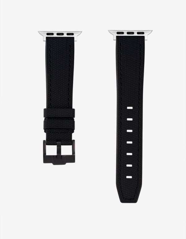 black fkm rubber watch strap laid flat with the silver apple watch adapter fitted at the lug end
